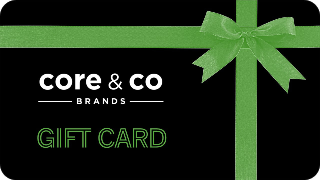 Gift card with green ribbon and 'core & co BRANDS' text on a black background