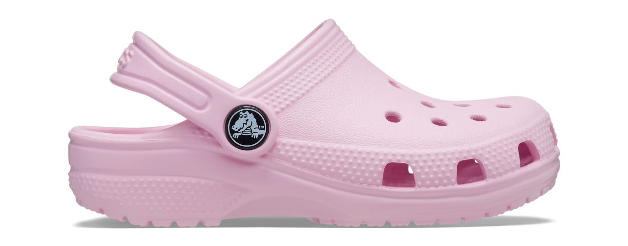 A single pink Crocs Classic Clog for toddlers with a closed heel and open-toe design, featuring the iconic Crocs logo on the strap.
