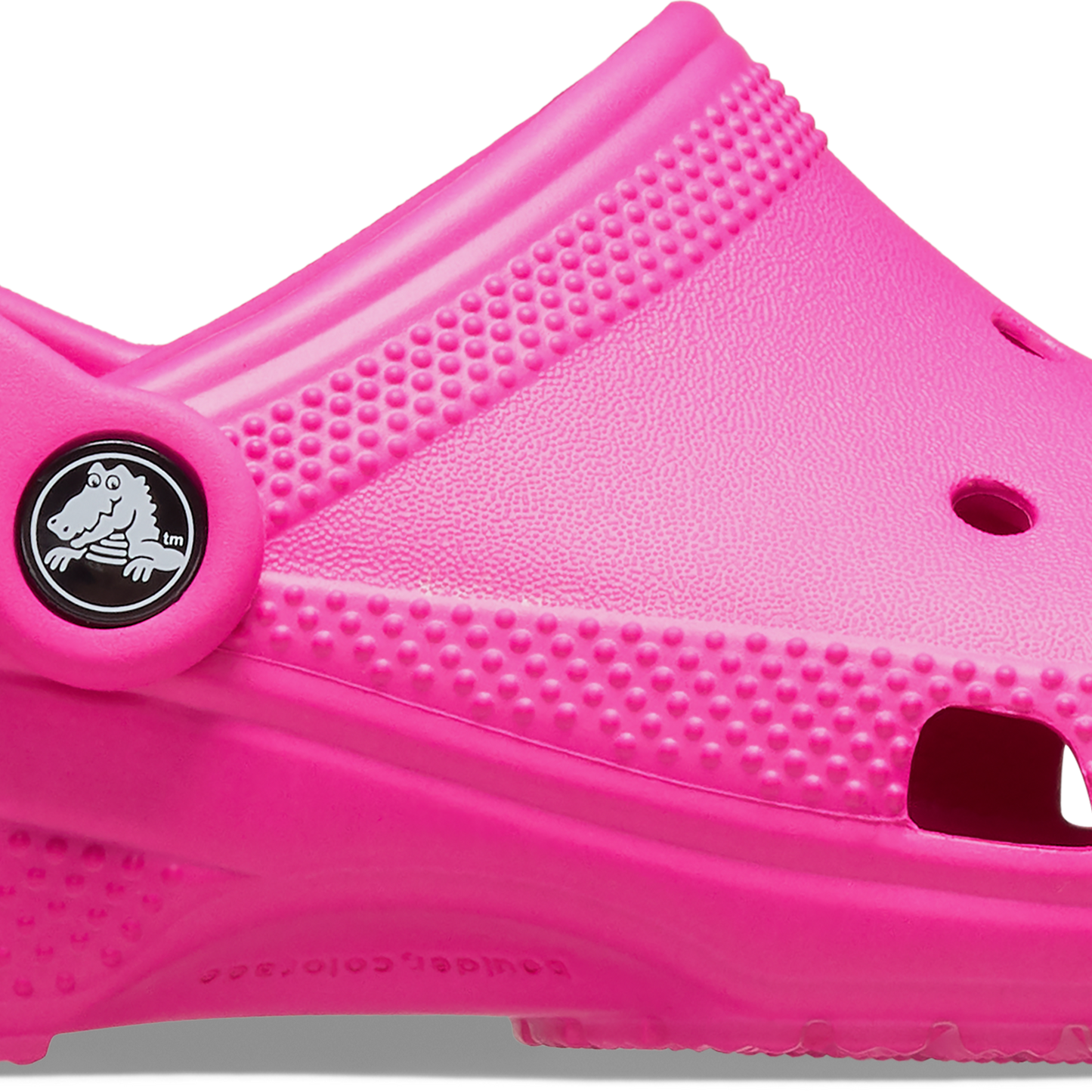 A pink kids Crocs Classic Clog with a closed heel and a strap at the back.