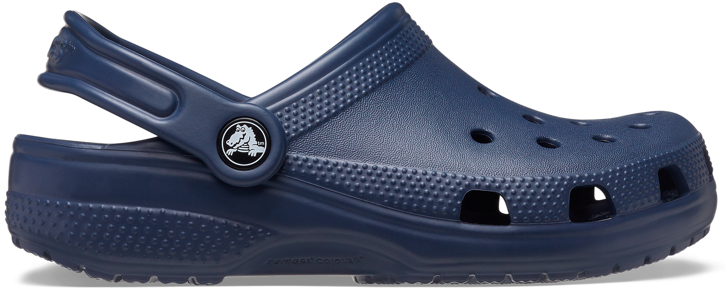 A navy blue classic clog for toddlers with a closed toe and strap closure.