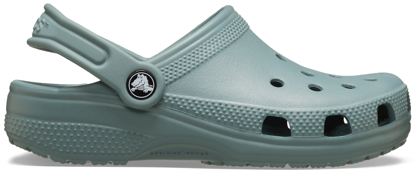 A single green Croc Classic Clog for toddlers with a closed heel and a pivoting heel strap.