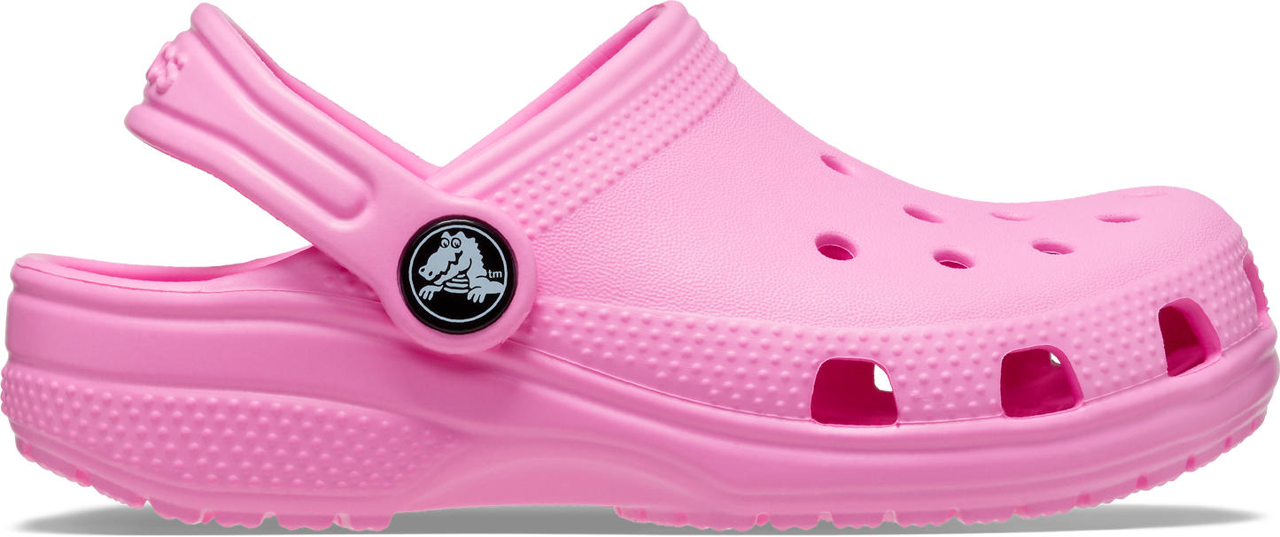 A taffy pink classic clog for toddlers with a slip-on design and a brand logo on the top.